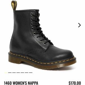 Black doc marten combat boots.